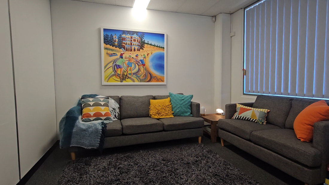 Coral Psychology waiting area with black seating